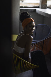 Young latin woman in balcony