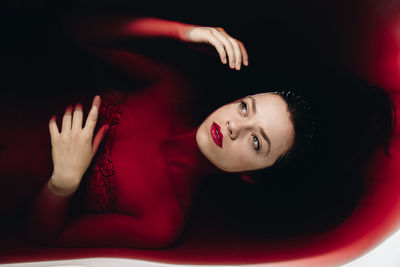 Directly above shot of beautiful young woman in bathtub