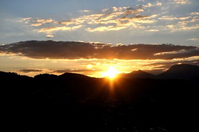 Scenic view of landscape against sky during sunset