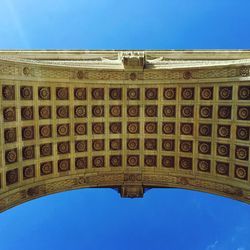 Low angle view of building against blue sky