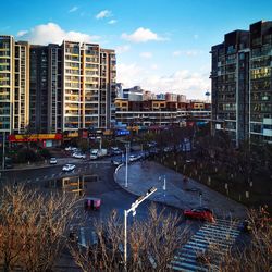 High angle view of street and buildings against sky