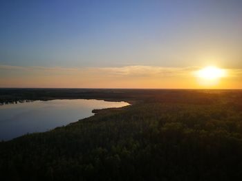 Scenic view of land against sky during sunset