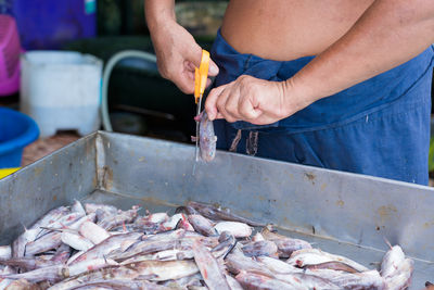 Midsection of man working at market