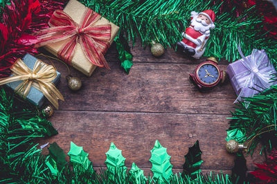 Directly above shot of christmas decorations on wooden table