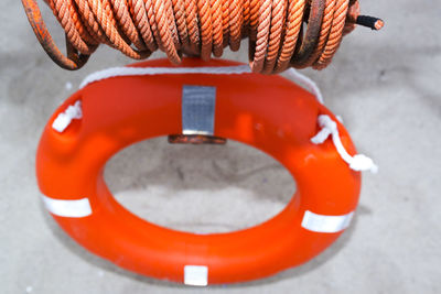 High angle view of life belt with rope