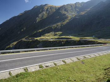 Road amidst field and mountains