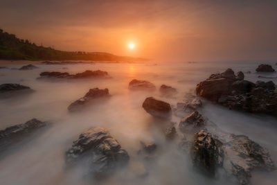 Scenic view of sea against sky during sunset