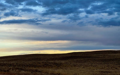 Scenic view of landscape against sky during sunset