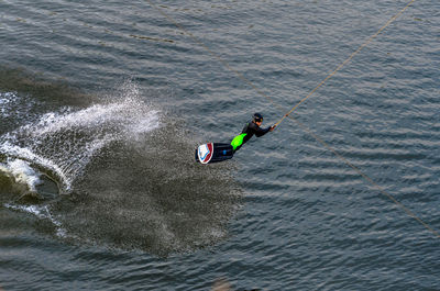 Man kiteboarding in sea