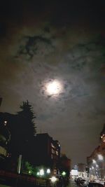 Low angle view of illuminated building against sky at night