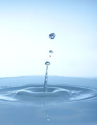 Close-up of water over white background