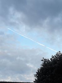 Low angle view of vapor trail against sky