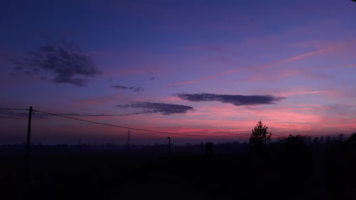 Scenic view of silhouette landscape against romantic sky at sunset