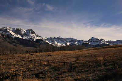 Scenic view of snowcapped mountains against sky