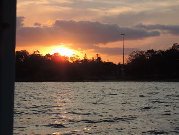 Scenic view of lake against dramatic sky