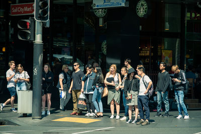 People standing on street in city