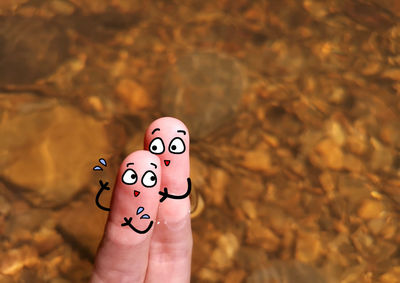 Close-up of person holding hand