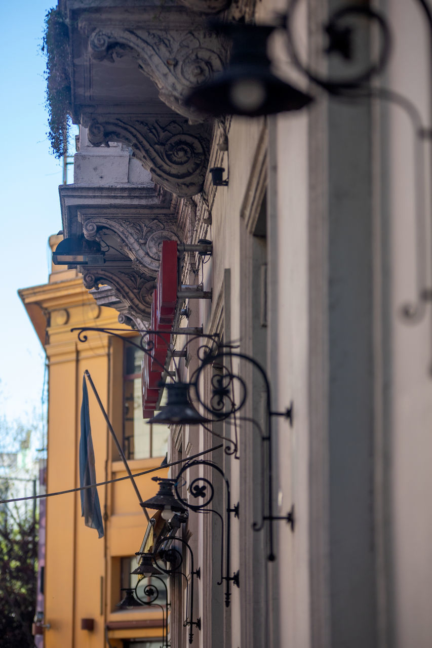 LOW ANGLE VIEW OF STREET LIGHT ON BUILDING