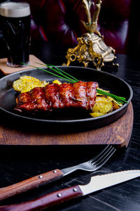 Close-up of meat on barbecue grill