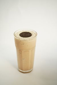 Close-up of coffee cup over white background