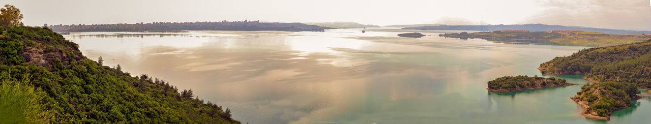 Panoramic view of sea and rocks against sky