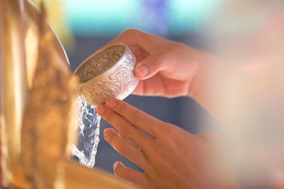 Midsection of woman holding ice cream