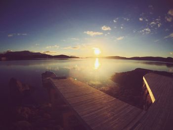 View of calm lake against mountain range