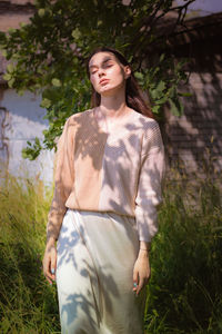 Young woman standing on field