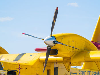 Low angle view of airplane against sky