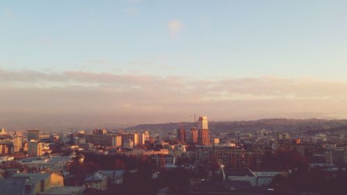 Cityscape against sky during sunset