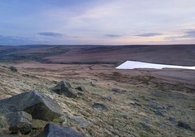 Scenic view of landscape and mountains against sky