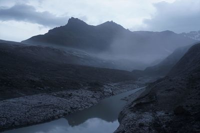 Scenic view of mountains against sky during winter
