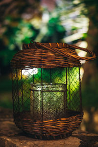 Close-up of wicker basket on field