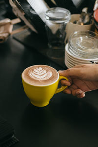 Making a coffee latte in the bar