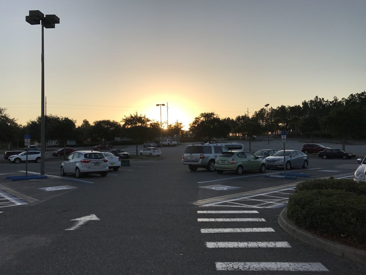 CARS ON ROAD IN CITY AGAINST SKY