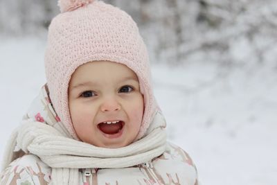 Portrait of cute baby girl in snow