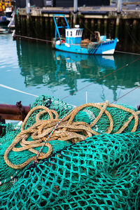 Fishing boats moored at harbor