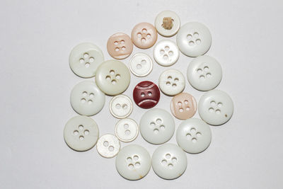 High angle view of coins on white background