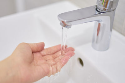 Midsection of person in bathroom