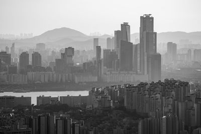 Modern buildings in city against sky