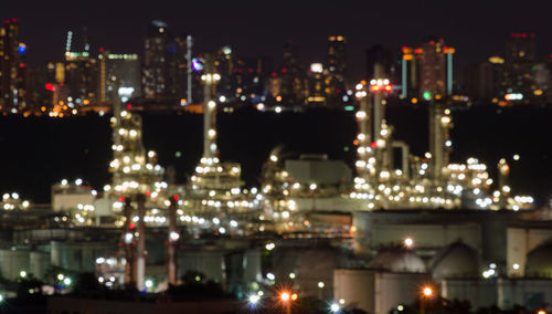 High angle view of buildings lit up at night