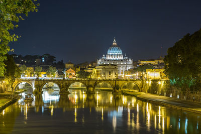 Reflection of illuminated cathedral in water at night