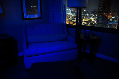 Illuminated blue window at home