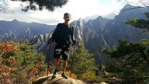 Full length of man and woman against mountains