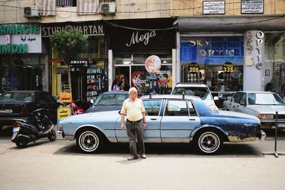 Man standing on street in city