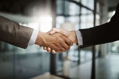 Close-up of business people shaking hands