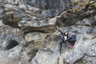 People standing on rock