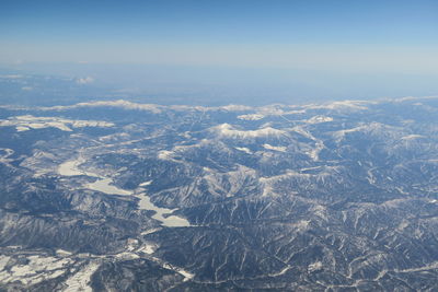 Aerial view of dramatic landscape against sky