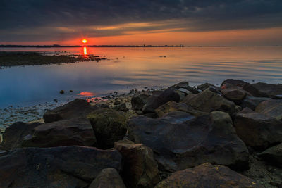 Scenic view of sea against sky during sunset