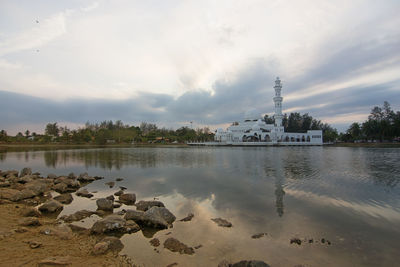 View of lake against cloudy sky